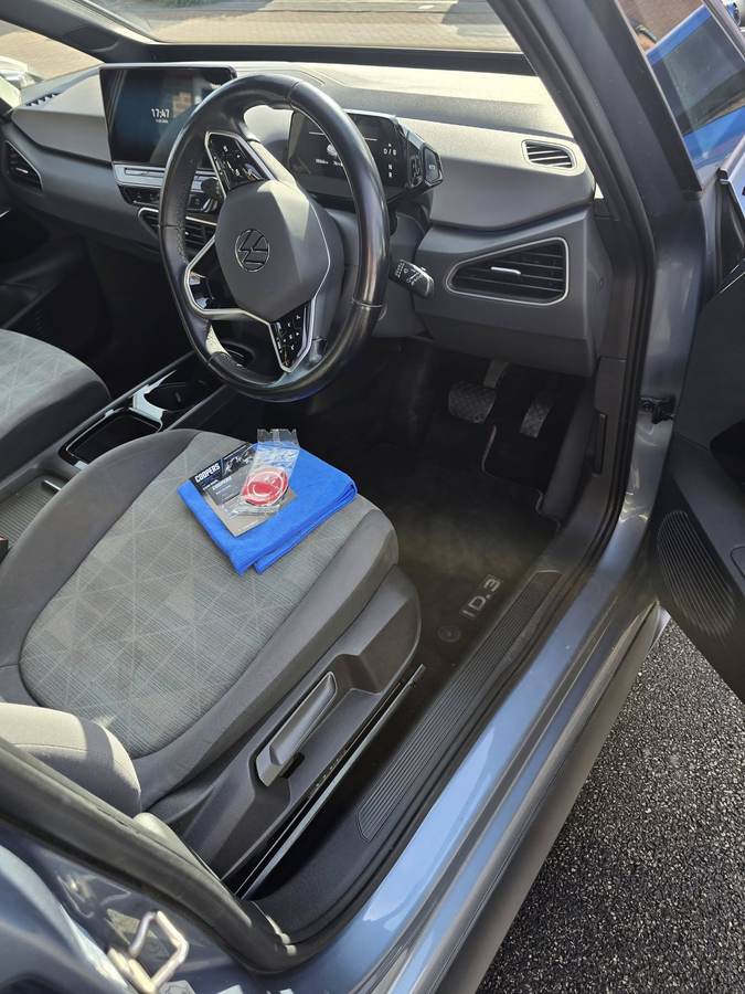 VW ID.3 interior driver footwell after Coopers valet, branded cloth on seat